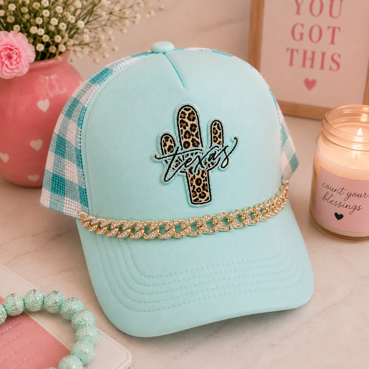 Mint Texas leopard cactus trucker hat - lifestyle shot with pink and mint accessories