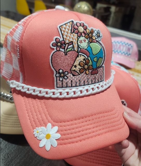 Back to School pink trucker hat with embroidered apple, globe, and floral patch, white chain brim and daisy accent