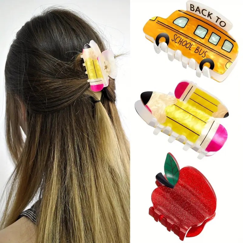 Back to school hair clips - apple, school bus, and pencil styles shown on model